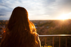 Woman looking at a sunset