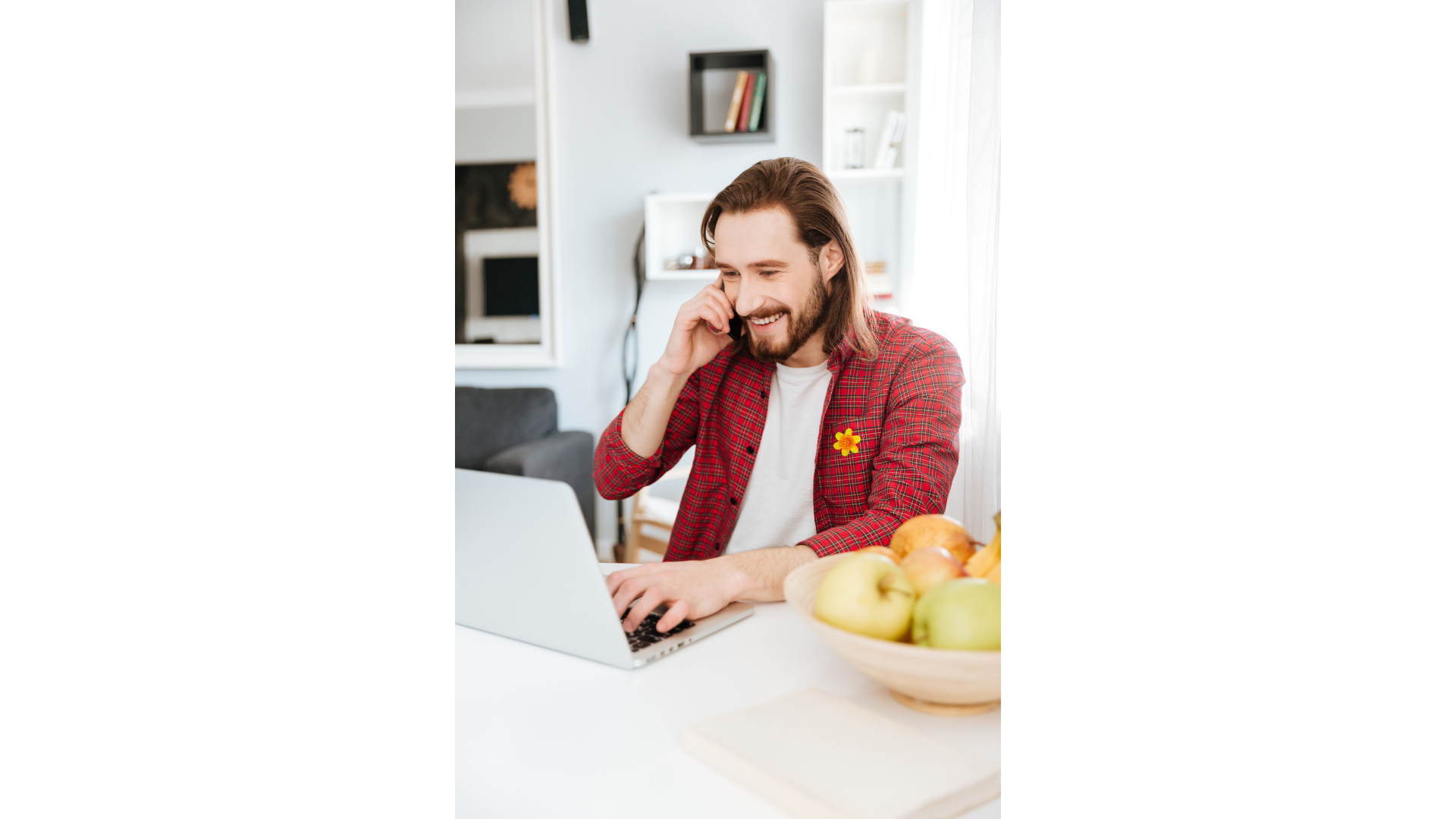 Man using phone and laptop