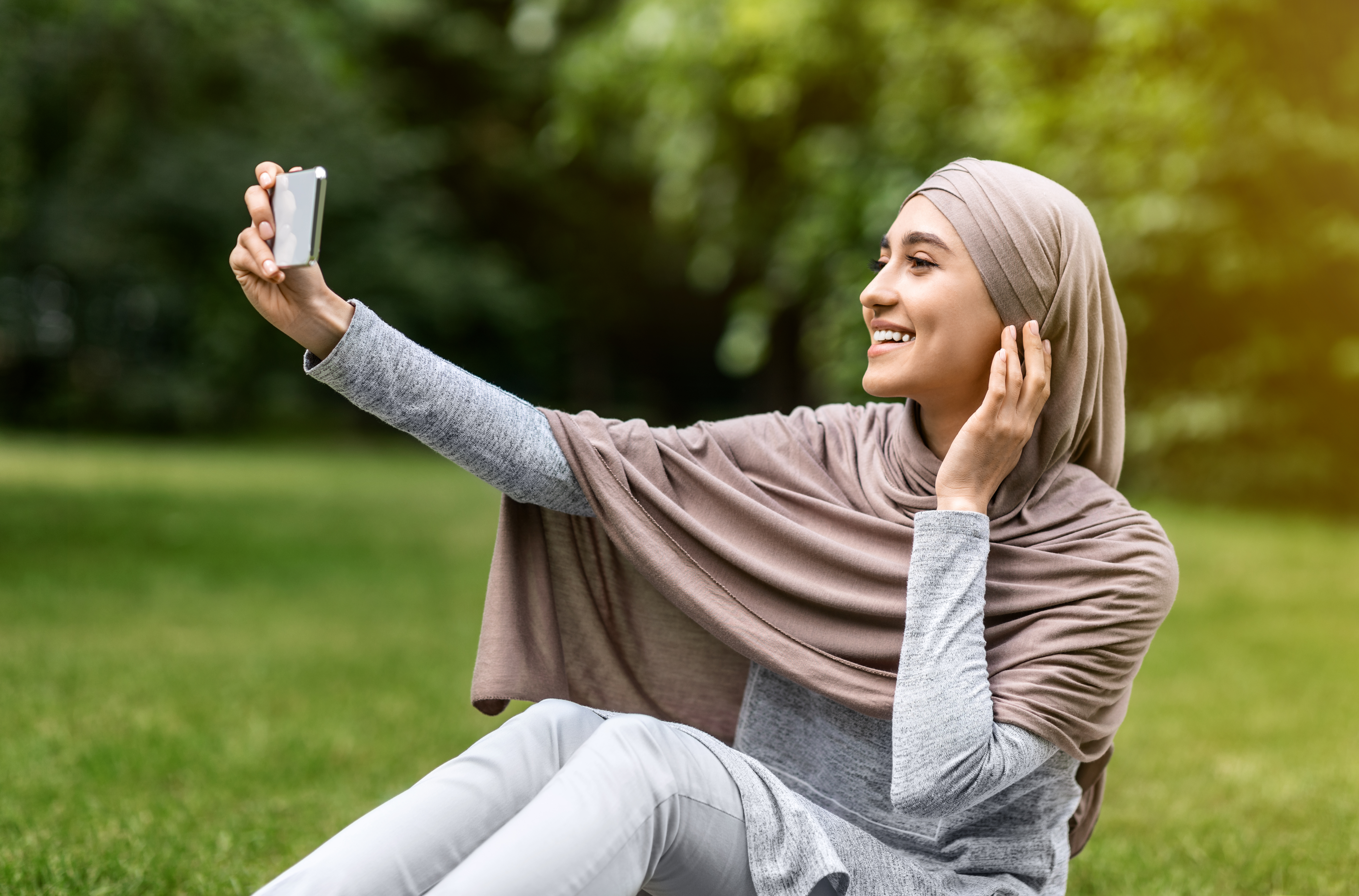 Woman taking selfie with phone