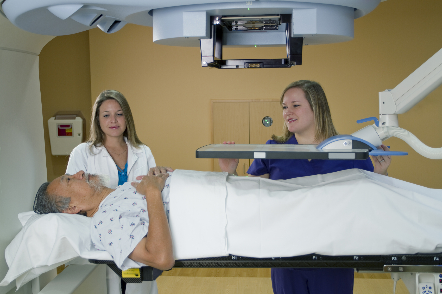 man going into a radiotherapy machine