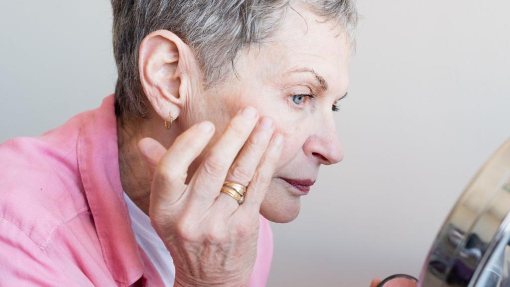 Older woman looking in mirror