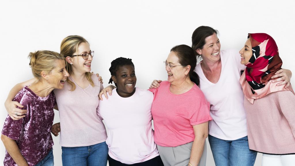 Group of women of various nationalities looking happy
