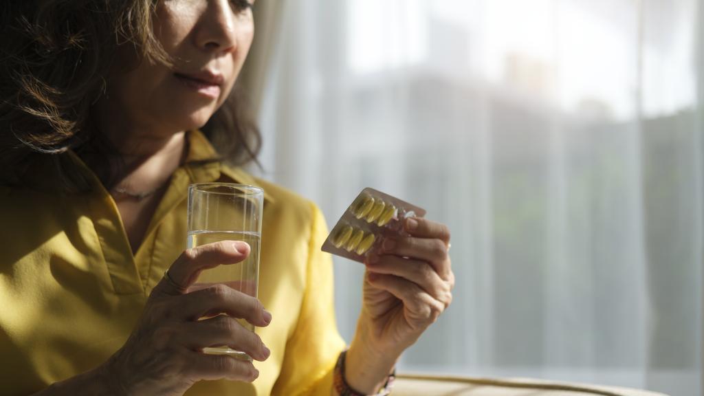 middle-aged Asian woman with tablets