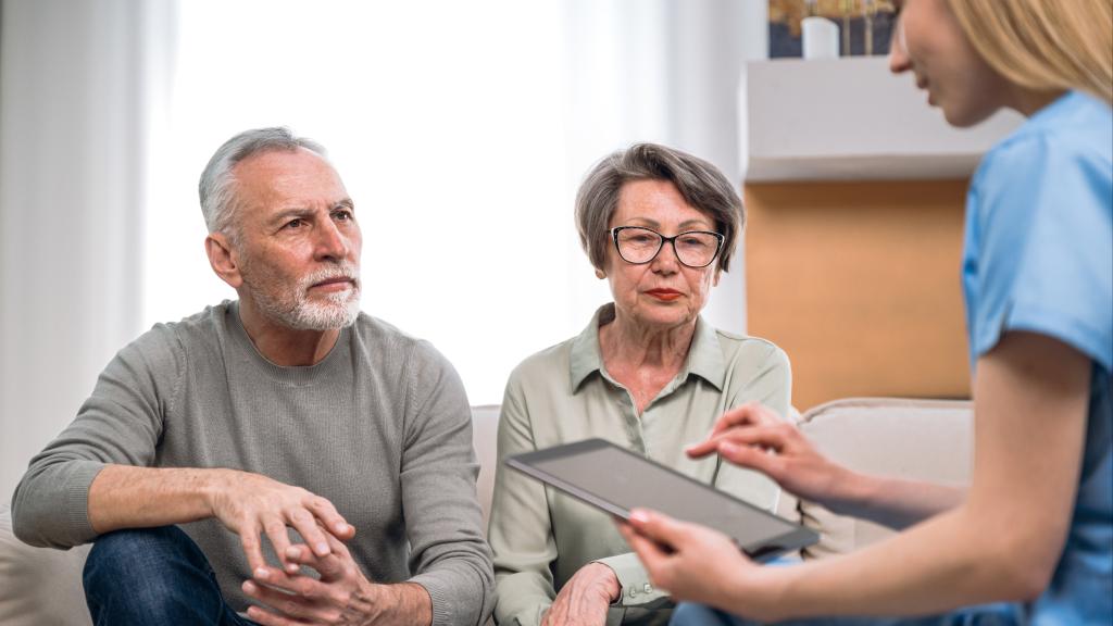 older white couple with nurse