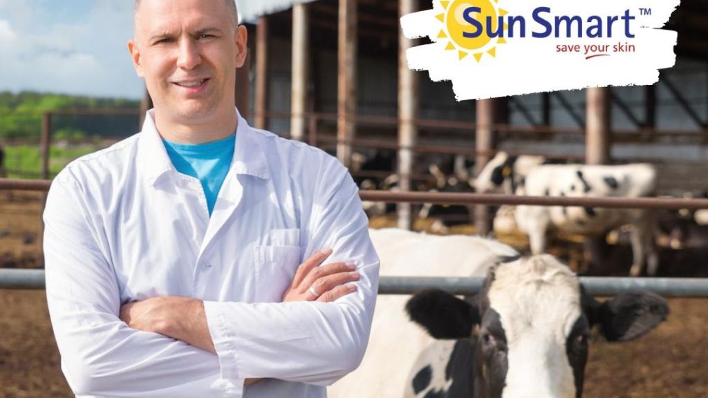 Be SunSmart on the farm Irish dairy farmer with cow