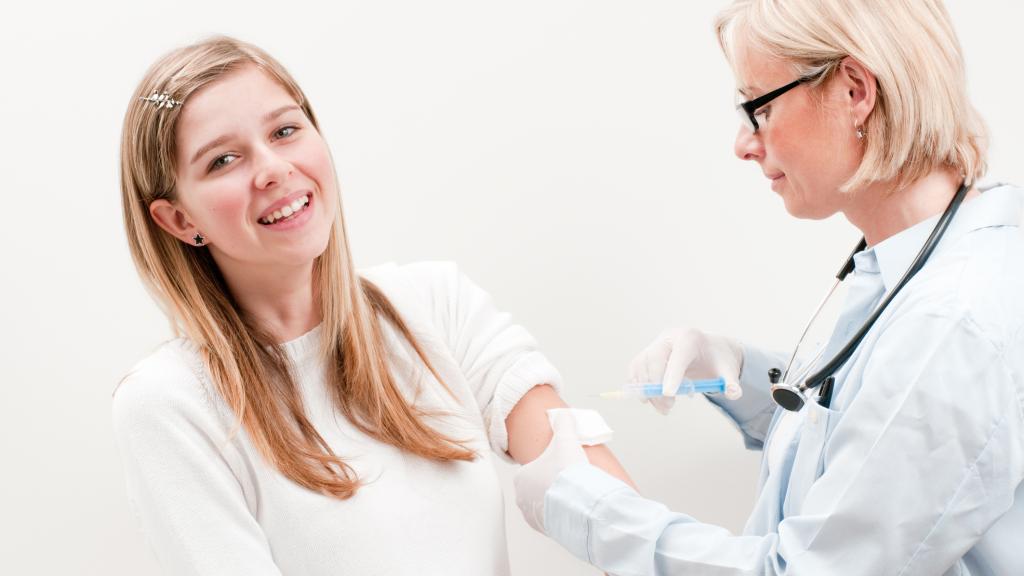 Teenage girl being vaccinated for HPV
